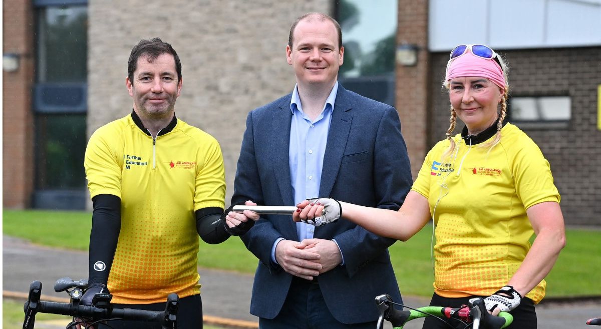  Economy Minister Gordon Lyons MLA pictured with cyclists from FE 400 team